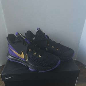 Nike Black and Purple Athletic Shoes with Gold Accents